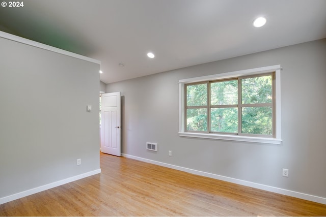 spare room with light hardwood / wood-style flooring