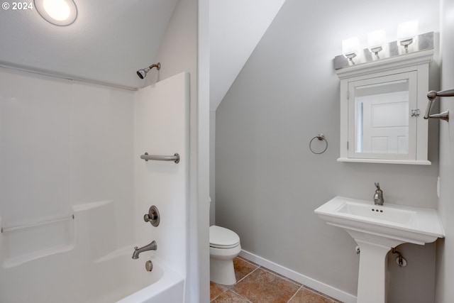 bathroom featuring tile patterned flooring, shower / tub combination, and toilet