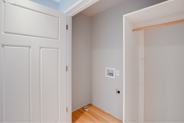 washroom with light hardwood / wood-style floors, hookup for a washing machine, and electric dryer hookup