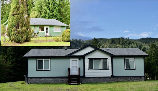 95851 Mckinnon Dr, Gold Beach, OR 97444 - ranch-style house featuring a front lawn, roof with shingles, crawl space, entry steps, and a forest view