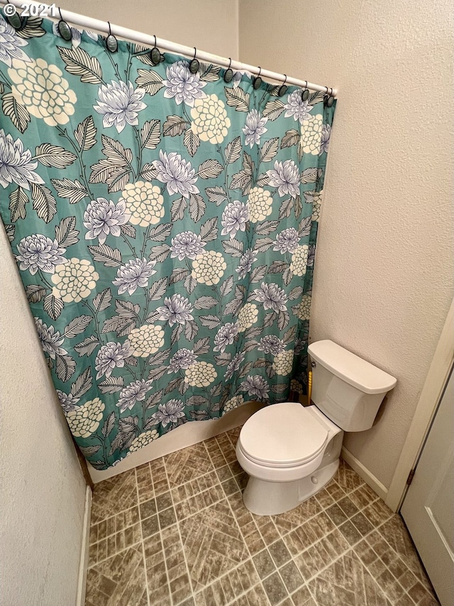 bathroom featuring toilet