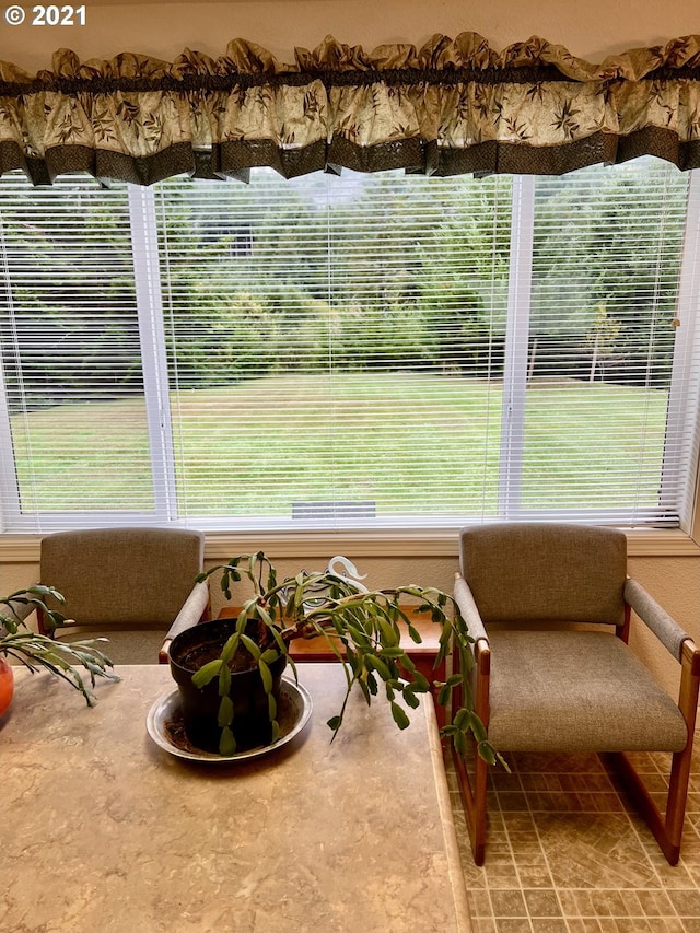 sunroom / solarium featuring a wealth of natural light