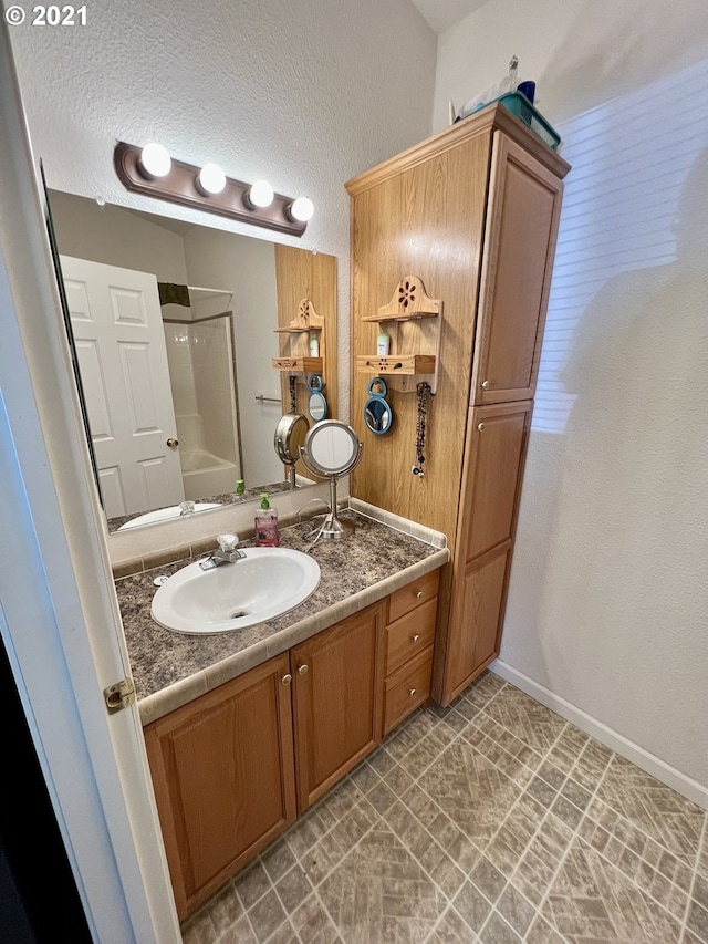 bathroom with vanity and tub / shower combination