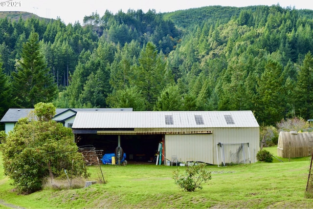 95851 Mckinnon Dr, Gold Beach, OR 97444 - exterior space with a lawn, a view of trees, and a mountain view