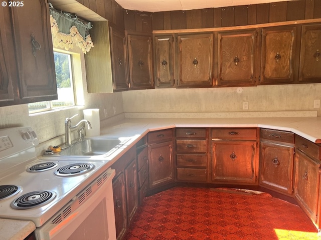 95851 Mckinnon Dr, Gold Beach, OR 97444 - kitchen featuring a sink, white electric range oven, and light countertops