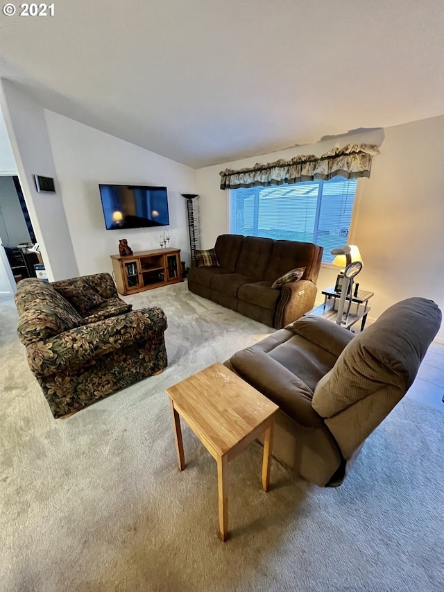 95851 Mckinnon Dr, Gold Beach, OR 97444 - carpeted living room featuring vaulted ceiling and visible vents
