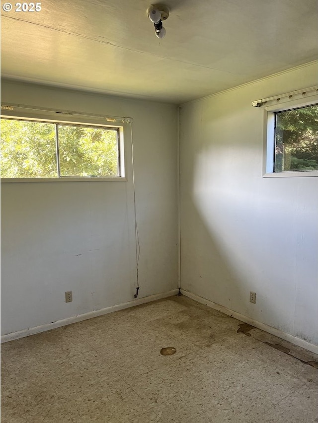 95851 Mckinnon Dr, Gold Beach, OR 97444 - empty room with baseboards and a wealth of natural light