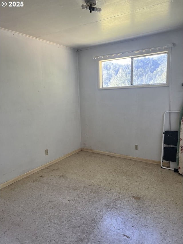 unfurnished room featuring plenty of natural light