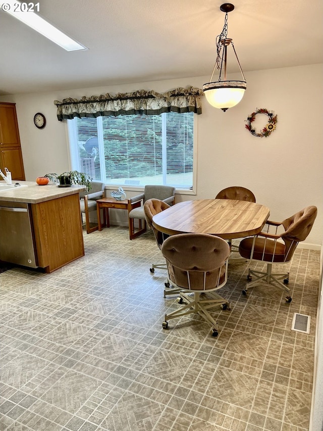 95851 Mckinnon Dr, Gold Beach, OR 97444 - dining room featuring a skylight and visible vents