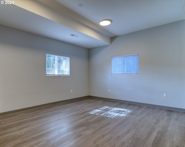 unfurnished room featuring light wood-type flooring