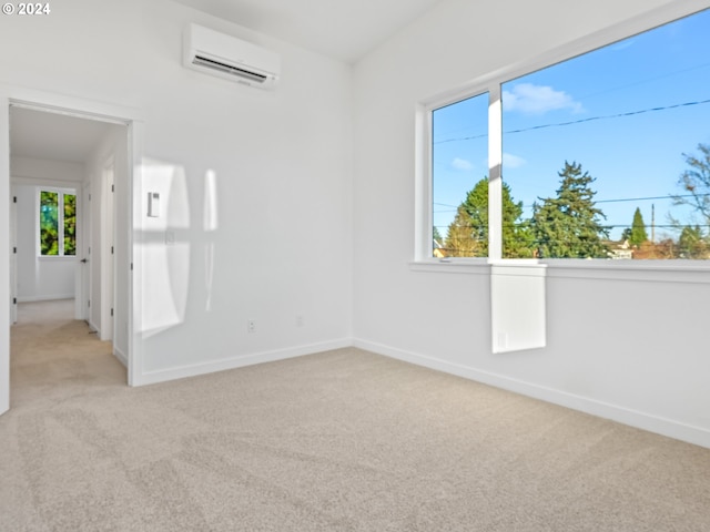 carpeted empty room with a wall mounted air conditioner