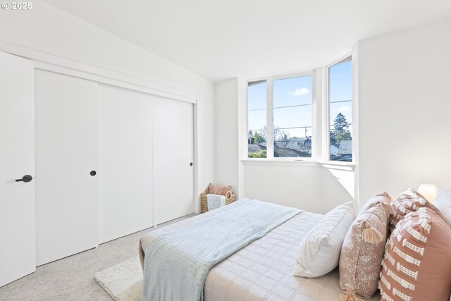 spare room with a wall unit AC, electric panel, and light hardwood / wood-style flooring