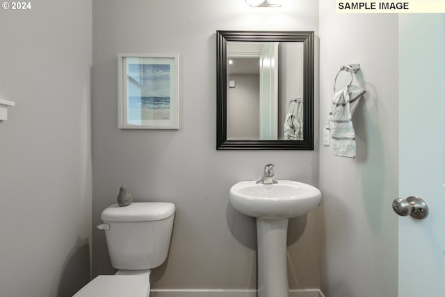 bathroom with sink and toilet