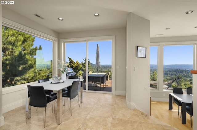 dining room with light tile floors