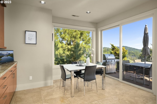 dining space with light tile floors