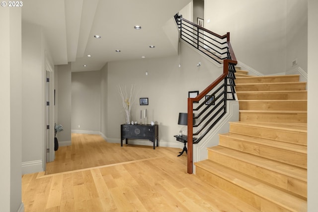 stairway featuring light hardwood / wood-style flooring