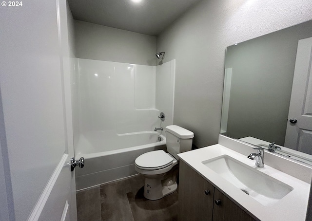 full bathroom with  shower combination, hardwood / wood-style floors, vanity, and toilet