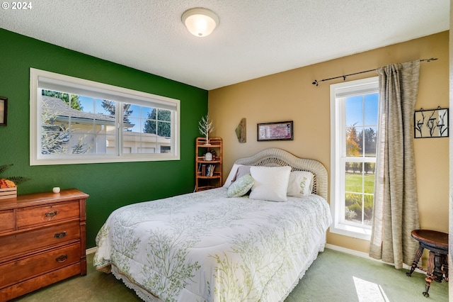 carpeted bedroom with a textured ceiling