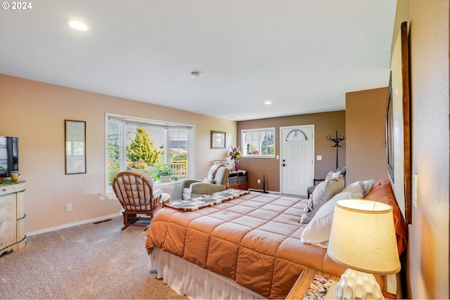 bedroom with light colored carpet