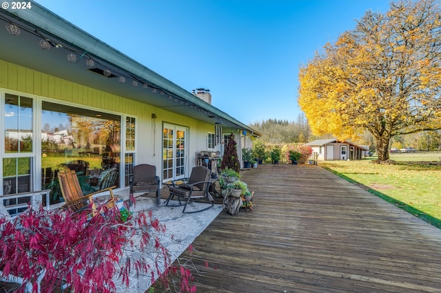 deck featuring a shed