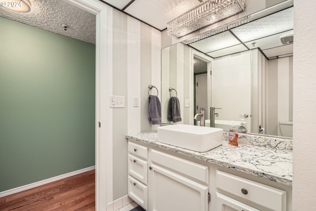 bathroom featuring vanity and wood-type flooring