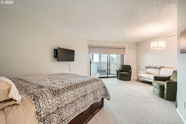 carpeted bedroom with access to outside and a textured ceiling