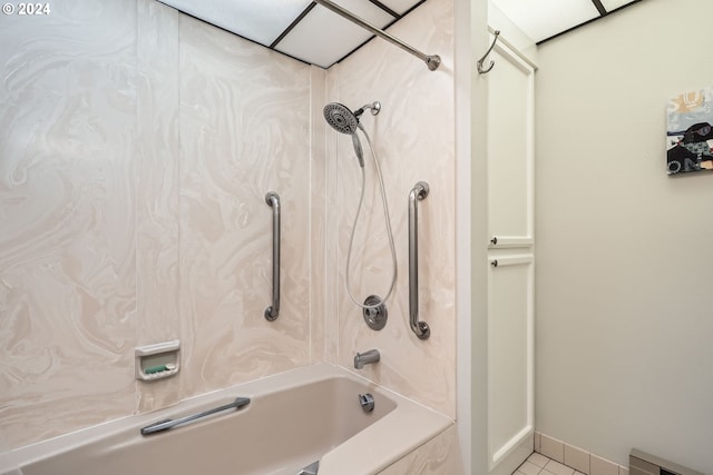 bathroom with tile patterned flooring and shower / washtub combination