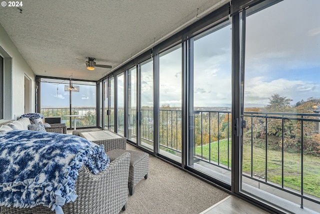 sunroom / solarium with ceiling fan and plenty of natural light