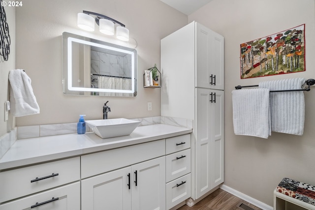 bathroom with vanity and hardwood / wood-style floors