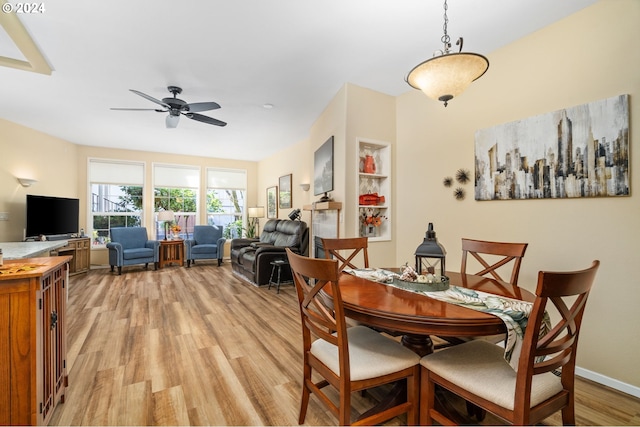 dining room featuring light hardwood / wood-style flooring and ceiling fan