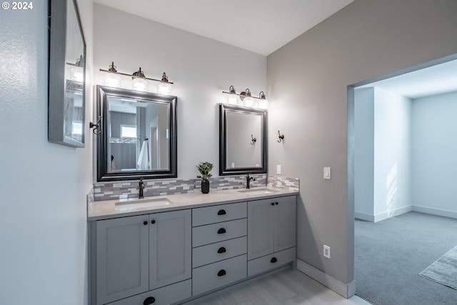 bathroom featuring decorative backsplash and vanity