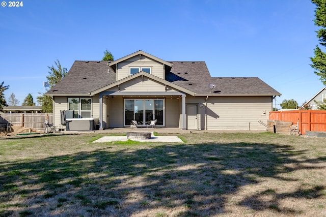 back of house featuring a patio area and a yard