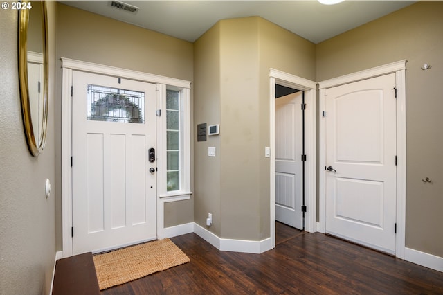 foyer with dark hardwood / wood-style floors