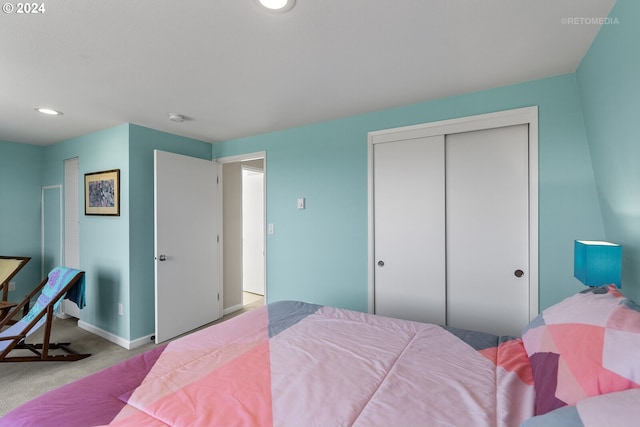 carpeted bedroom featuring a closet