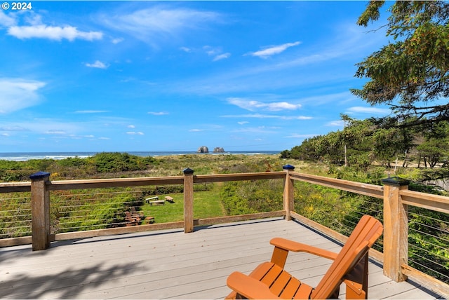 wooden deck with a water view