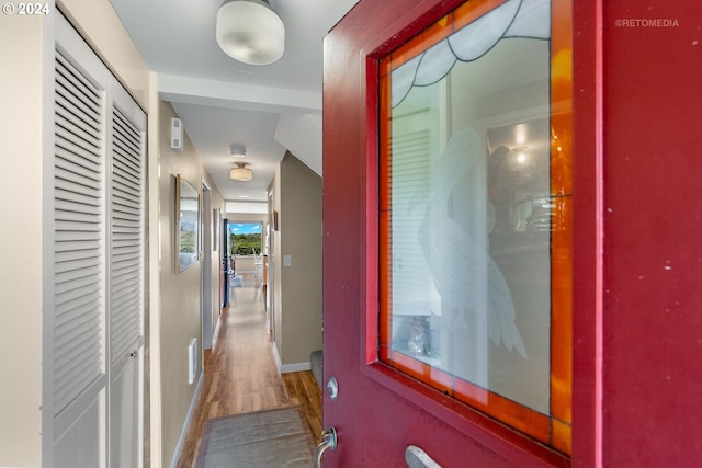 corridor featuring hardwood / wood-style floors