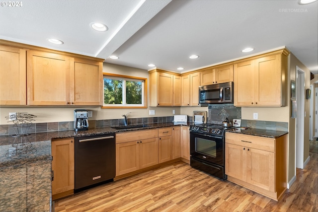 kitchen featuring light brown cabinets, sink, light hardwood / wood-style floors, and black appliances