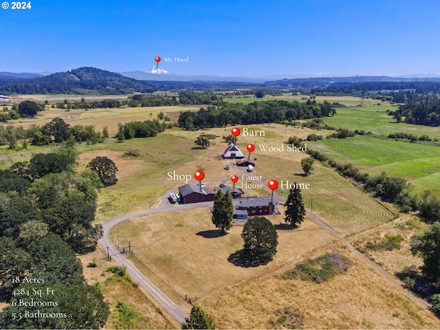 aerial view featuring a mountain view and a rural view