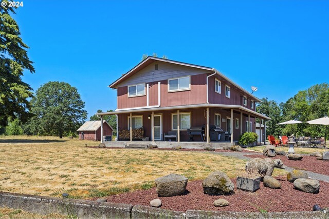 back of house with a yard