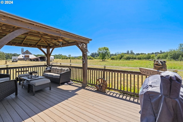 wooden terrace featuring grilling area, a yard, and a gazebo