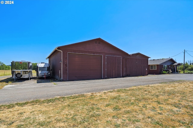 garage with a yard