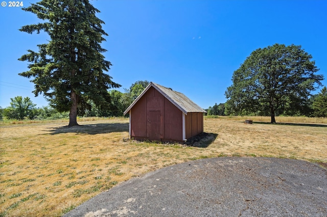 view of outdoor structure with a lawn