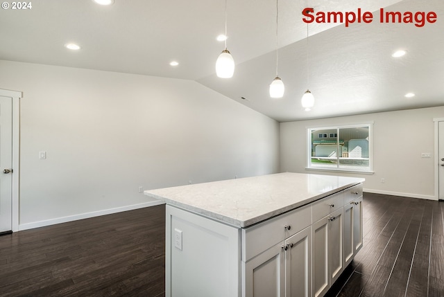 kitchen with vaulted ceiling, pendant lighting, white cabinets, dark hardwood / wood-style floors, and a kitchen island