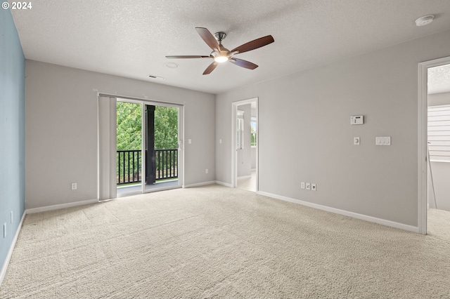 unfurnished room featuring ceiling fan, carpet, and a textured ceiling