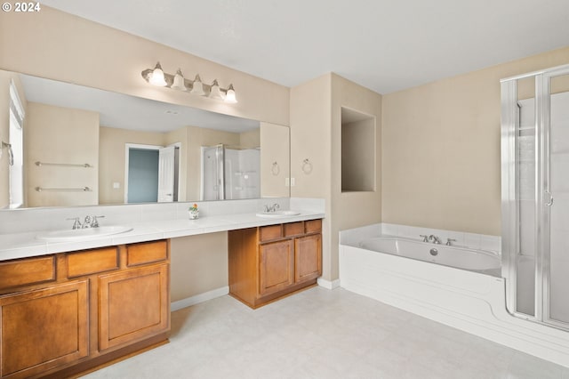 bathroom with tile patterned flooring, double vanity, and plus walk in shower