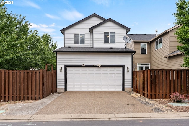 front of property with a garage