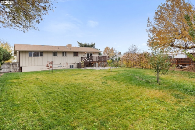 view of yard featuring a wooden deck