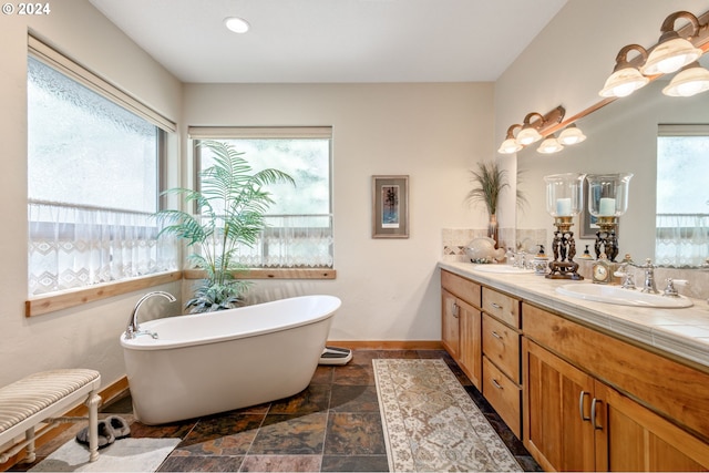 bathroom with a tub to relax in and vanity