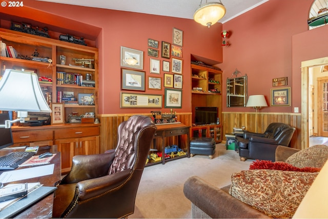 carpeted office with wood walls