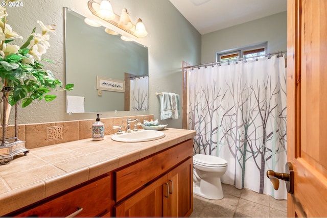 bathroom featuring vanity, tile patterned flooring, curtained shower, and toilet